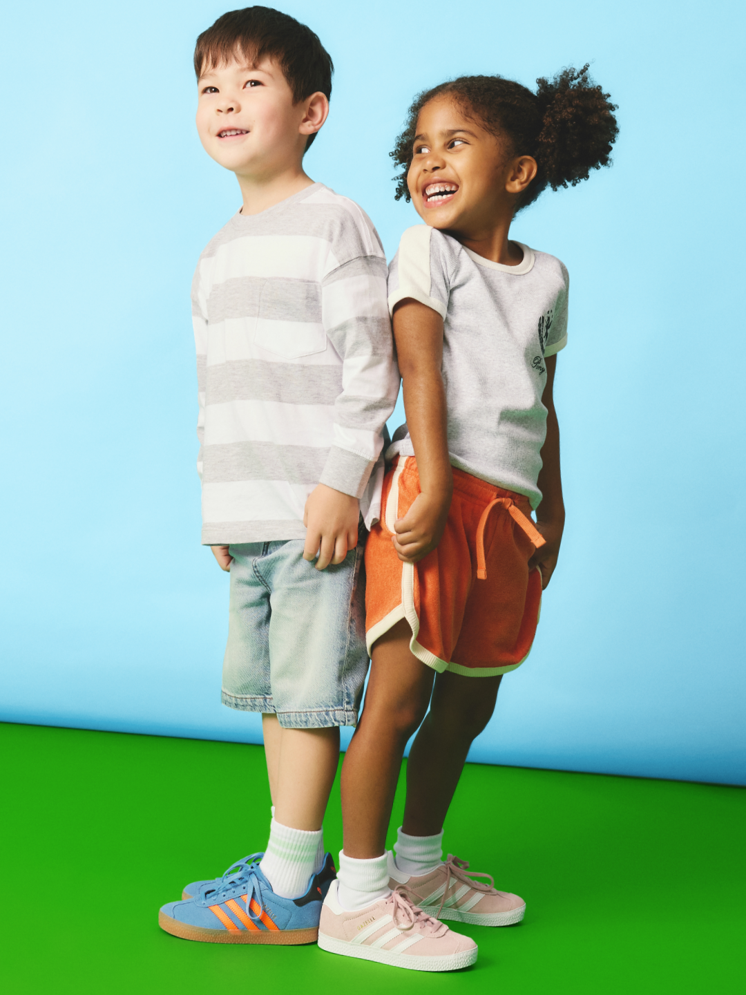 Kids wearing colourful kids shoes, running and playing outdoors